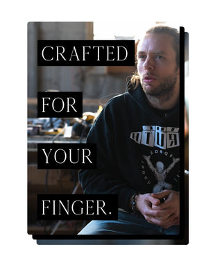 Man holding a product with text 'Crafted for your finger' on a white background